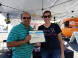 Lemoore Councilmember Ray Madrigal presents Witchy Woman Soaps founder Stephanie Walters a proclamation at a Chamber of Commerce ribbon cutting Friday night in Lemoore.